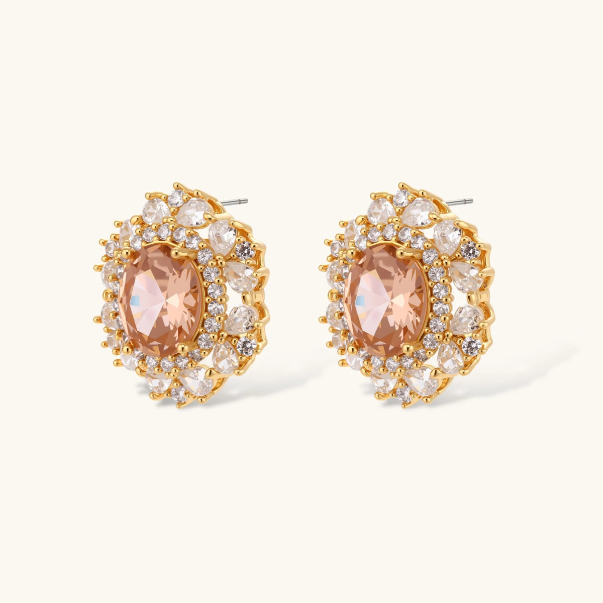 Ornate gold-plated jewelry set featuring peach center stone surrounded by clear AAA cubic zirconia crystals