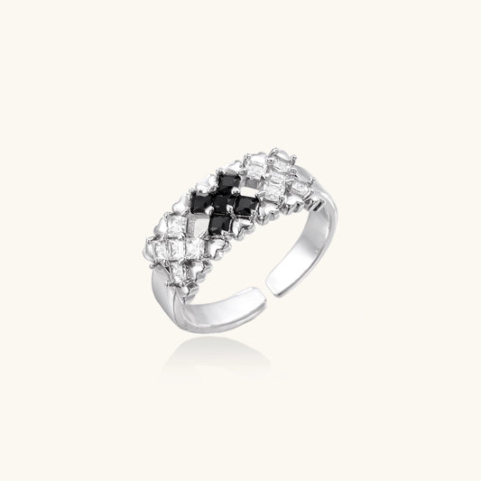 Adjustable white gold plated ring with geometric grid of black and clear zirconia stones in checkerboard pattern