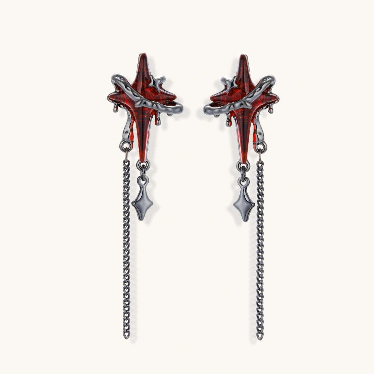 Gothic red resin dagger earrings with silver chain details and S925 posts on white background